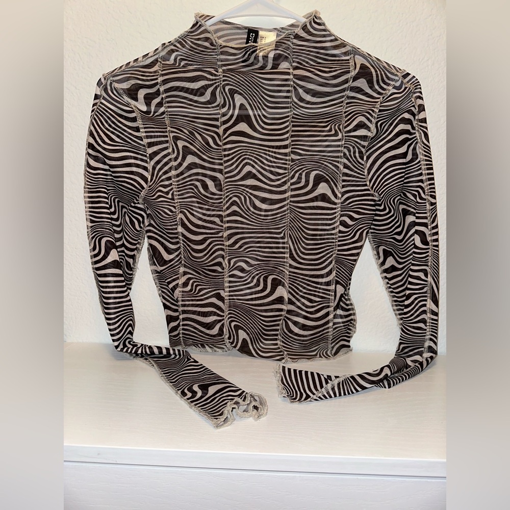DIVIDED H&M sheer long-sleeve top with a black and white zebra print.